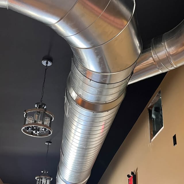 Exposed metal ductwork pictured in Williams Heating and Cooling’s project gallery