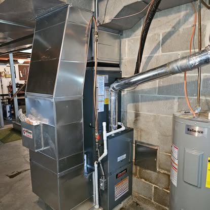 Furnace equipment with a custom metal duct transition, from Williams Heating & Cooling