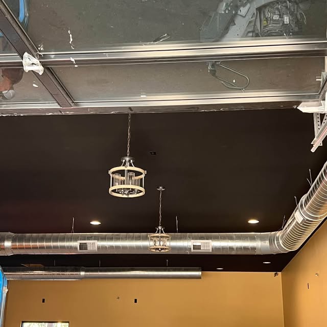 Exposed ductwork below an open ceiling, from Williams Heating & Cooling