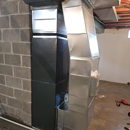 Close-up of a rectangular metal duct transition, from Williams Heating & Cooling